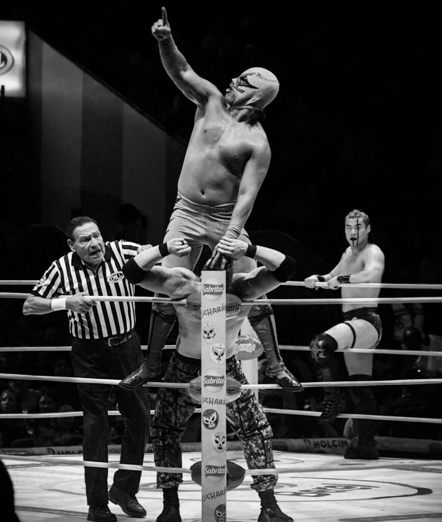 High-energy wrestling match in a packed arena